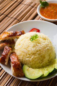 singapore hainan chicken rice with materials as background