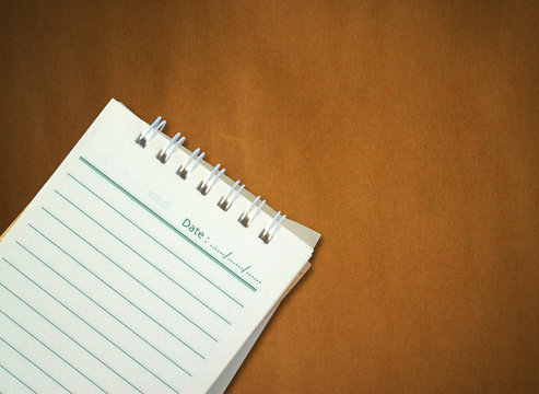 Note Paper On Brown Paper Background