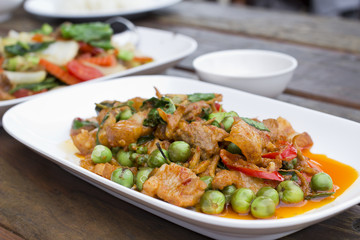 Thai food, Pork, Spicy Boar mixed with spices on plate