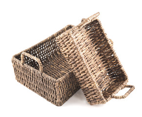Two brown wicker baskets isolated