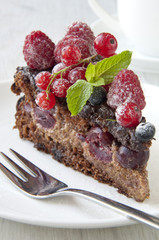 Chocolate cake with strawberry and raspberry and cherries