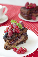 Chocolate cake with strawberry and raspberry and cherries