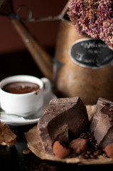 piece of chocolate bar with hot chocolate drink