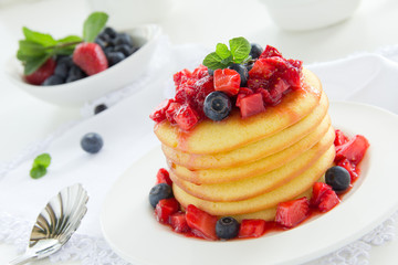 Pancakes with summer berries: strawberries, blueberries.