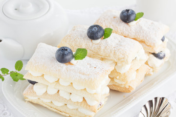 Cake with cream and blueberry.