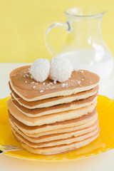 Pancakes with berries and honey.