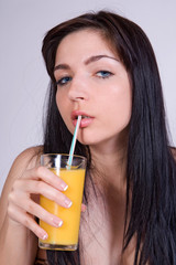 beautiful girl with glass of orange juice