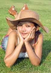 portrait of a young woman in a hat.