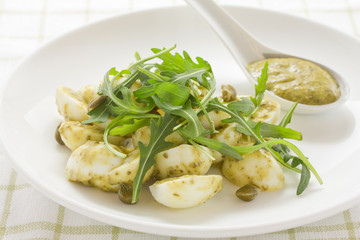 Salad with eggs and arugula.
