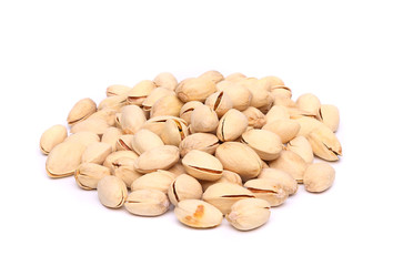 pistachios heap on the white background close-up