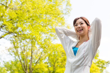 young asian woman relaxing in the park