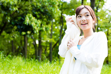 young asian woman relaxing in the park