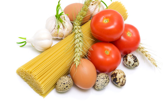 vegetables, spaghetti and egg on a white background close-up