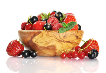 Fresh berries in wooden bowl