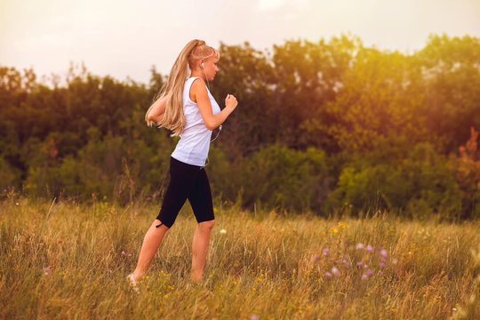 fitness woman sport running blonde runner girl nature lifestyle