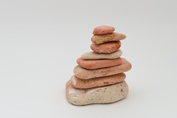 Stones stacked pyramid on a white background
