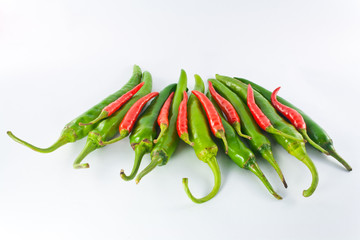 Red and green pepper on a white background