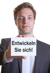 Mann im Anzug mit Karte ENTWICKELN SIE SICH!