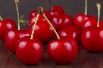 Cherry on wooden plank