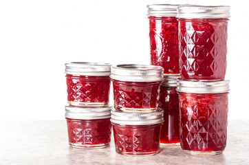Fresh strawberries preserved in jars