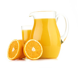 Jug, glass of orange juice and orange fruits