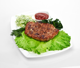 Grilled steak on a white plate