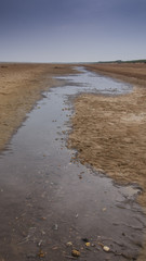 Stream of water on sand
