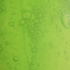 soap bubbles green liquid background
