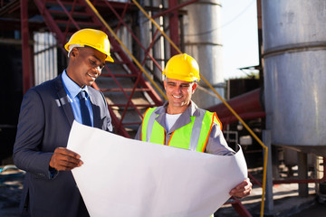industrial engineers with blueprint