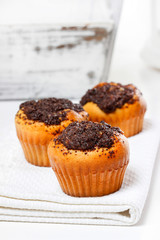 Poppy-seed muffins on white napkin