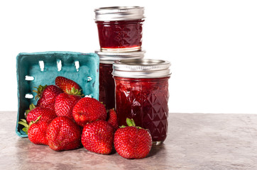 Fresh strawberries preserved in jars