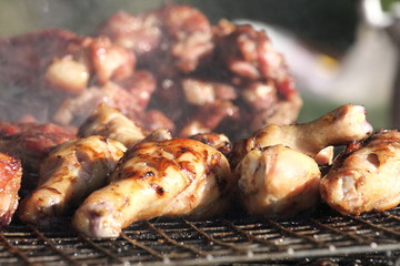 Grilled chicken on charcoal stove of Thailand, street food.