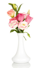 Bouquet of eustoma flowers in vase isolated on white