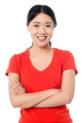 Casual young girl posing, arms crossed