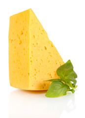 Cheese and basil isolated on white