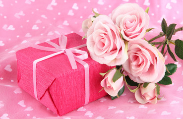 Romantic parcel on pink cloth background