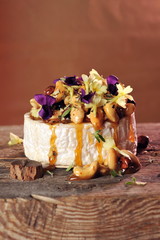 Grilled soft brie / Camembert cheese with honey, cashew nuts