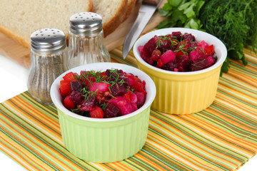 Beet salad in bowls on table close-up