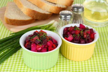 Beet salad in bowls on table close-up
