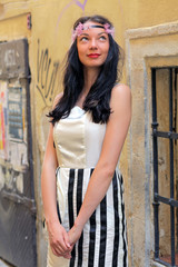 Fototapeta premium Beautiful young girl in old town - Bratislava, Slovakia