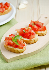 Fresh bruschetta on cutting board