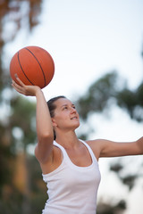 girl plays basketball