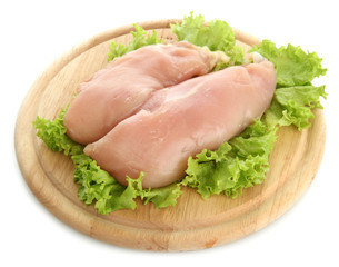 raw chicken meat on cutting board, isolated on white