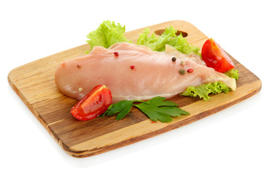 raw chicken meat on cutting board, isolated on white