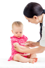 doctor vaccinating child isolated on a white