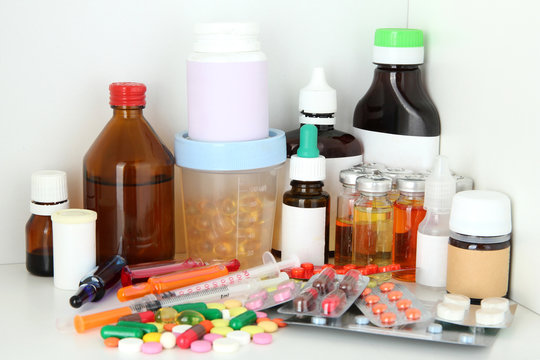 Medical Bottles And Pills On Shelf