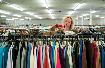 shoe browsing in a thrift store © Gabriel Cassan