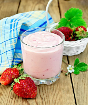 Milkshake with strawberries in a white basket