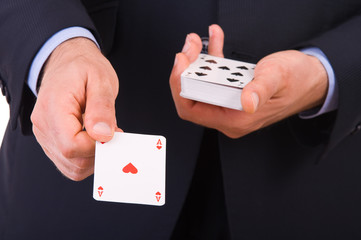 Businessman showing playing cards.