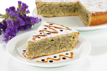 Delicious poppy seed cake isolated on white